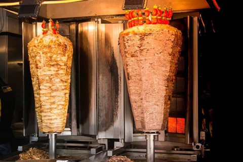 Traditional Turkish food Doner Kebab. Turnspit skewing kebap kebab shawarma