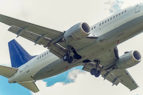 A passenger aircraft flying over from the frog's perspective