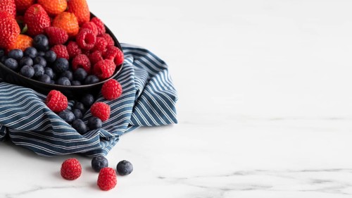 High angle bowl with strawberries raspberries blueberries