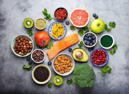 Selection of healthy products and superfoods: salmon, fruit, vegetables, berries, goji, spirulina,