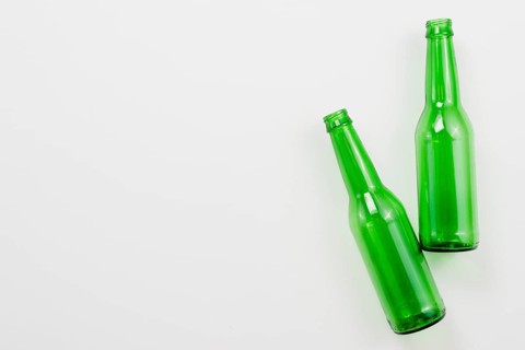 Green empty bottles white background