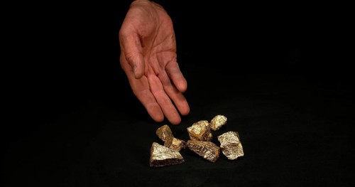 Hand and Gold Nuggets, Nugget, Falling on Black Background