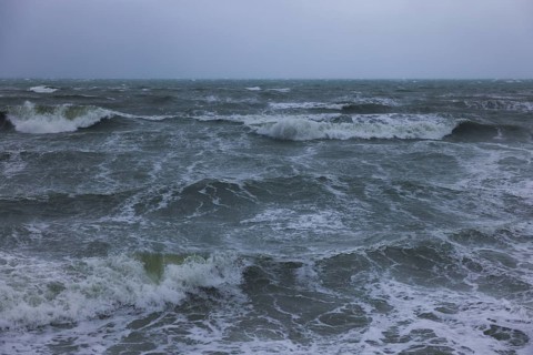 Stormy sea, foaming sea in storm with high waves on the English Channel, Portbail, Cotentin,