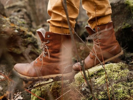Close up boots walking forest