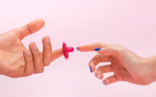 Close up man woman hands with condom