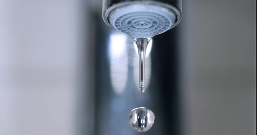 Water Flowing from the Tap, making a drop of water