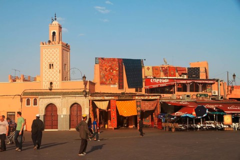 Mosque and souvenir shop on the edge of Djema el Fnaa, Marrakech Morocco