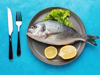 Top view fish with lemon plate
