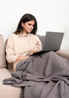Woman couch working from home