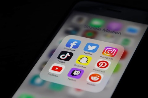 Social media icon, detailed view of a smartphone with social media apps, Facebook, Twitter,