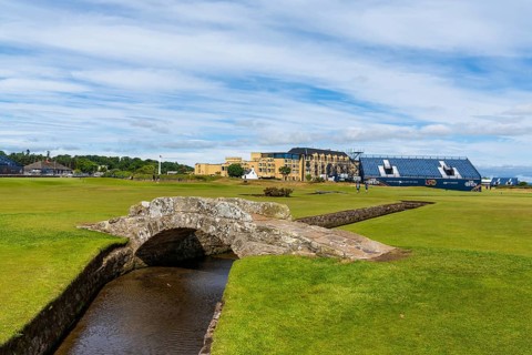 St. Andrews, United Kingdom - 22 June, 2022: view of the historic Swilcan Bridge and 18th hole of