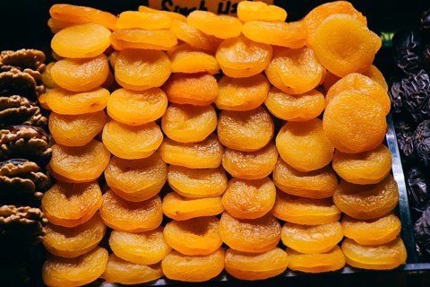 Heap of sweet dried apricots Natural dried fruits harvest concept
