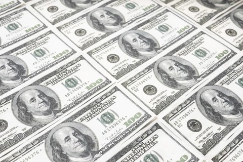 US dollar background. Closeup of a rows of banknotes hundred dollar bills. American currency