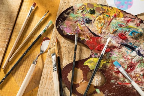 Paint palette with brushes spatula