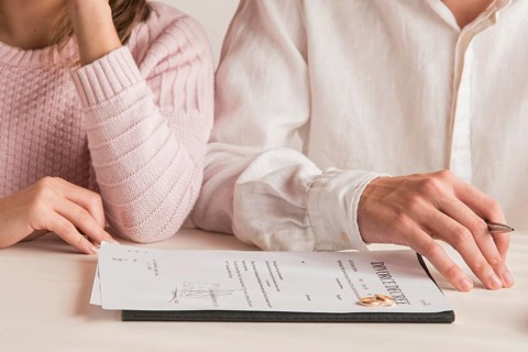 Close up couple with divorce decree