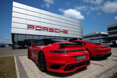 Porsche dealer with two red Porsche cars, one of which is a 911 turbo S, Plattling, Lower Bavaria,