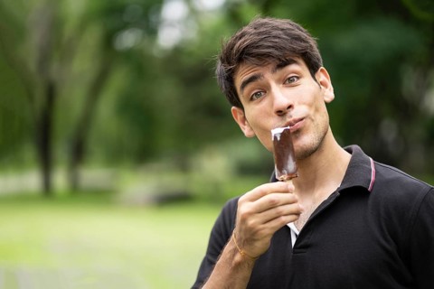 Man enjoying ice cream in the park