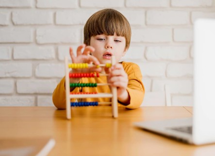 Front view child with abacus desk
