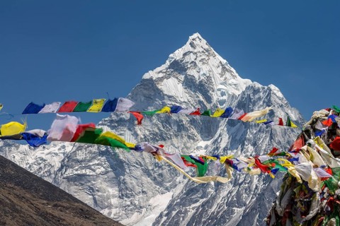 Ama Dablam, the well-known mountaineering peak in the Everest Region, seen with Buddhist prayer