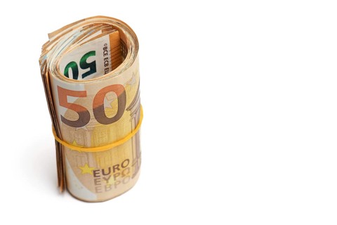 Roll of euro banknotes fastened with a rubber band isolated on a white background