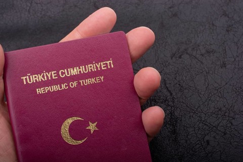 New Turkish passport. Travel, tourism, emigration and passport control concep