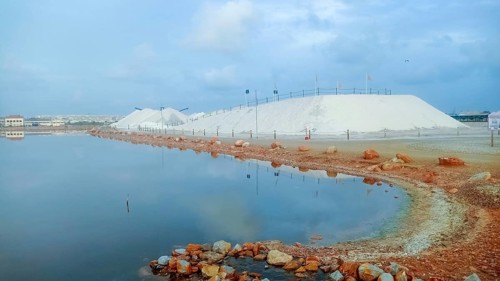 Mountains of sea salt in the Torrevieja salt mining industry in the lagoon, Spain, Europe