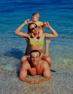 Family with baby on the beach/sea