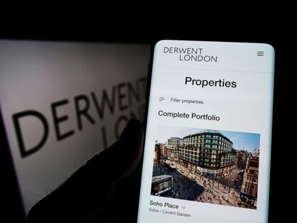 Stuttgart, Germany, 03-06-2022: Person holding cellphone with website of British real estate