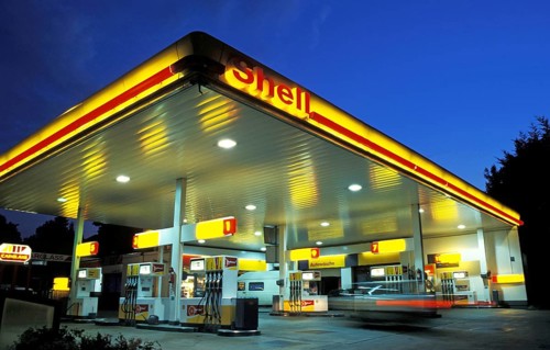 Shell Gas Station at sunset or night, a car entering, motion blur, Munich, Bavaria, Germany, Europe