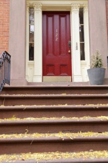 Red front door of a townhouse with steps and house number 122, Manhattan, New York City, New York,