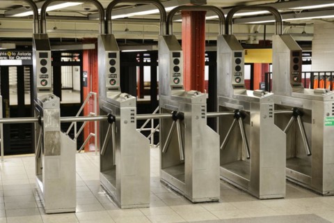 An empty underground station with rows of turnstiles, Manhattan, New York City, New York, USA,