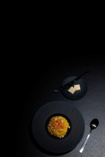 Elegant Plate with Risotto alla Milanese with Saffron and Parmesan Cheese in Lugano, Ticino,