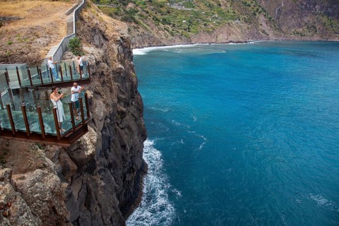 Tourists look at view from Glass bottomed skywalk, Cabo Girao, Funchal, Madeira, Portugal, Europe