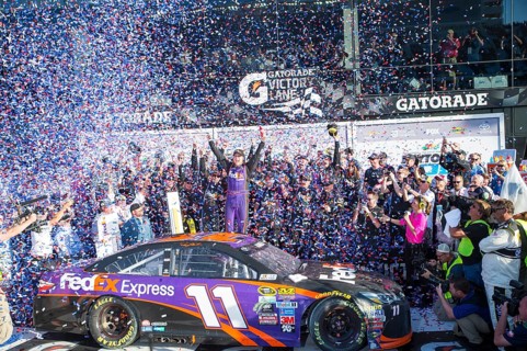 Daytona Beach, FL, Feb 21, 2016: Denny Hamlin celebrates his win in Victory Lane during the Daytona