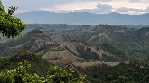 View from Civita di Bagnoregio on hilly landscape Valle dei Calanchi with tuff rocks, Latium,