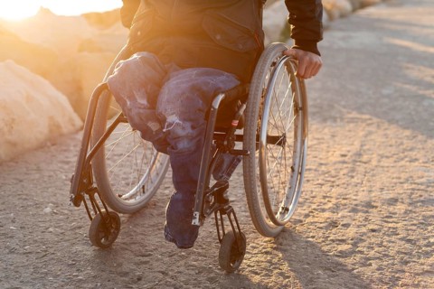 Close up man wheelchair beach