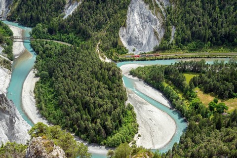 A train of the Glacier Express travels through the Rhine Gorge, Ruinaulta, Anterior Rhine, Flims,