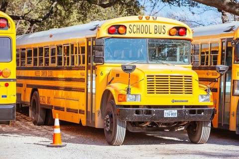 Camp Wood, USA, January 27 2013: Parked school bus in a parking lot in rural town of Camp Wood in