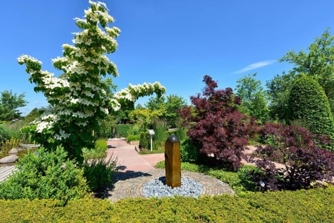 Theme garden with flower dogwoods and fountains in the Park of Gardens, Bad Zwischenahn, Ammerland,