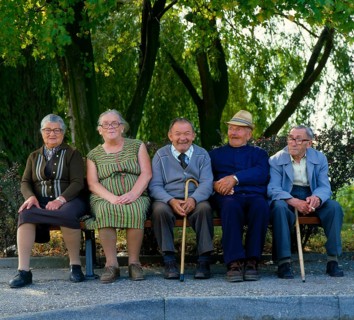 Old people from old people's home on bench