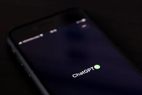 Symbolic image artificial intelligence, detailed view of a smartphone with the app ChatGPT,