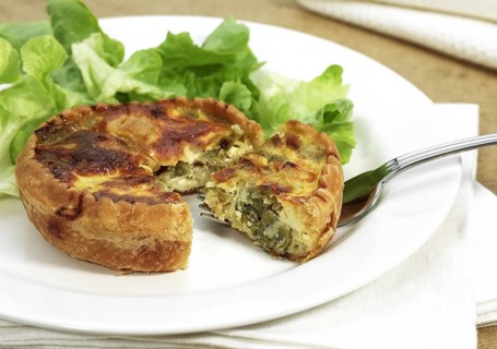 Leek quiche and salad on a plate