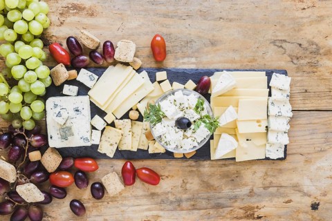 Tasty appetizers with cheese plate tomatoes grapes. Resolution and high quality beautiful photo