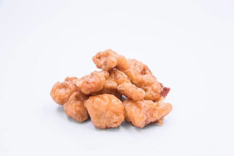 Homemade crispy chicken popcorn white background