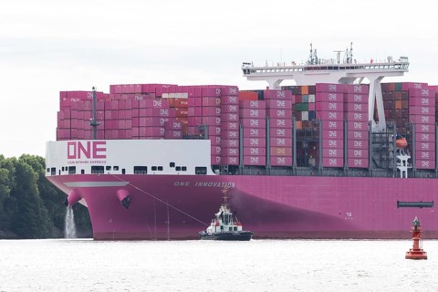 Pink container freighter One Innovation of the shipping company Ocean Network Express (Europe) Ltd.