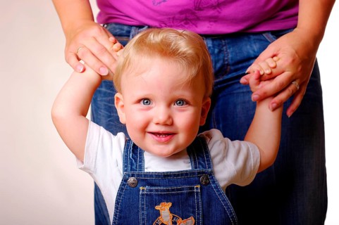 Little boy learns to walk