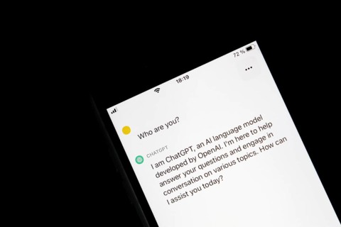 Symbolic image artificial intelligence, detailed view of a smartphone with the app ChatGPT,