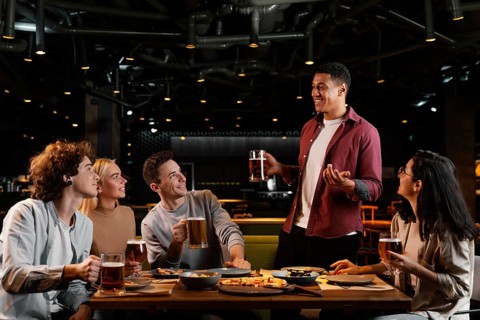 Medium shot friends with beer pub