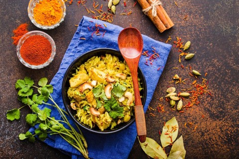Biryani rice, traditional Indian dish. Biryani spicy rice, chicken, nuts. Indian rice bowl, spices,
