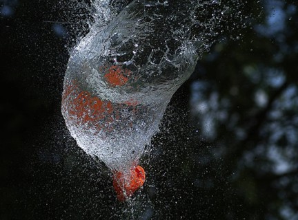 Shot Breaking Water Filled Orange Balloon
